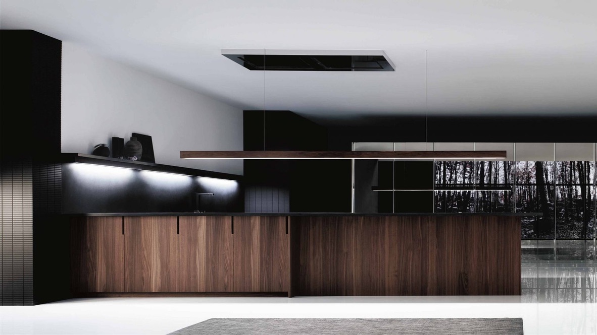 A sleek European kitchen featuring dark wood cabinetry, a minimalist black backsplash, and modern lighting for a contemporary and luxurious design.