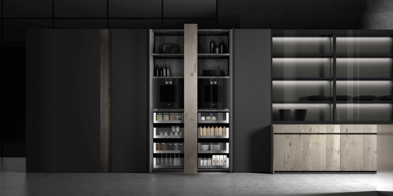 Modern kitchen with a sleek, dark storage unit featuring built-in appliances and well-organized shelves.