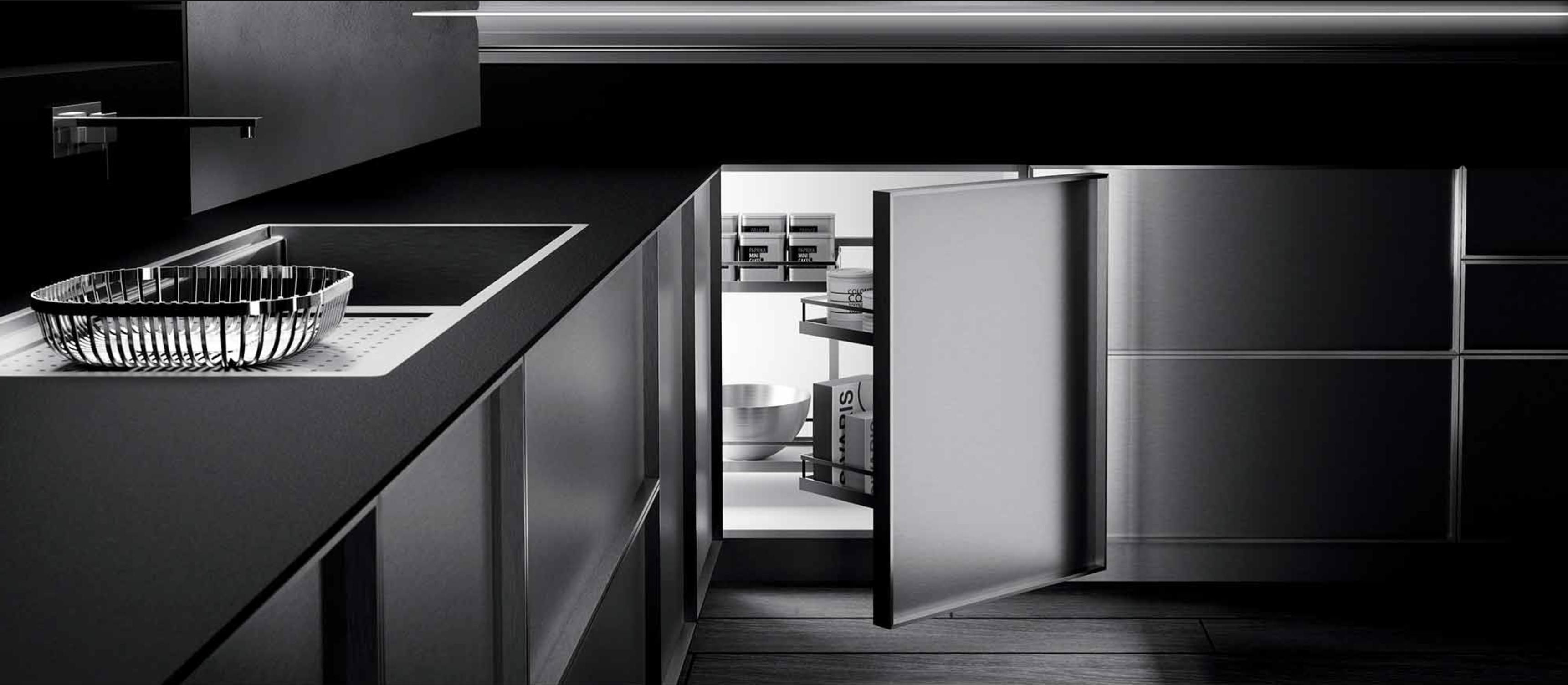 Sleek modern kitchen featuring a built-in stainless steel pull-out refrigerator drawer.