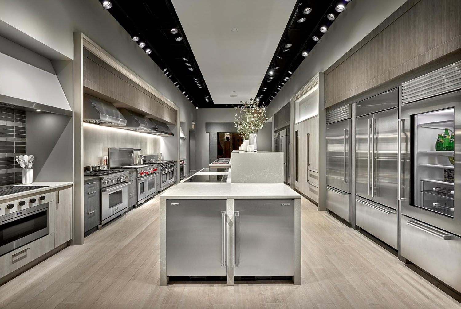 Modern kitchen with sleek, dark stone surfaces and minimalist cabinetry design, emphasizing luxury and sophistication.