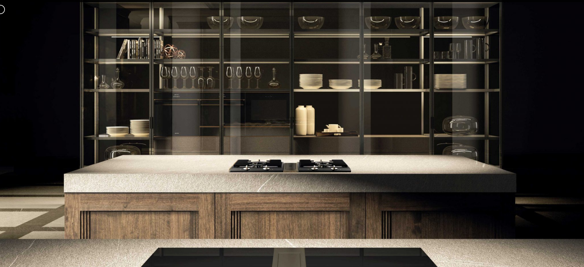 Modern kitchen with a large island, built-in stovetop, and open shelving showcasing neatly organized glassware and dishware.