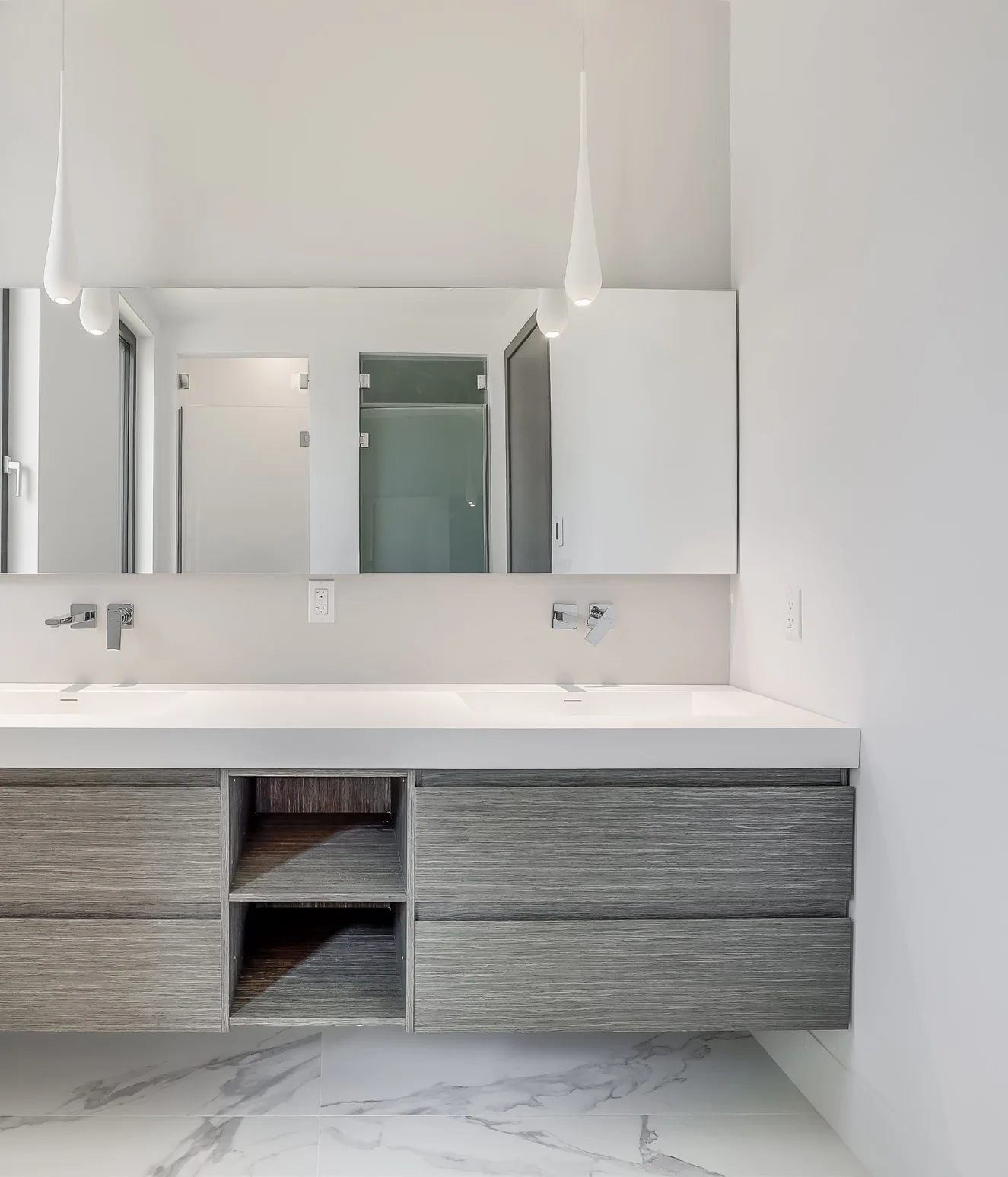 Bathroom vanity with stained oak grain and lacquered surfaces in Wellesley