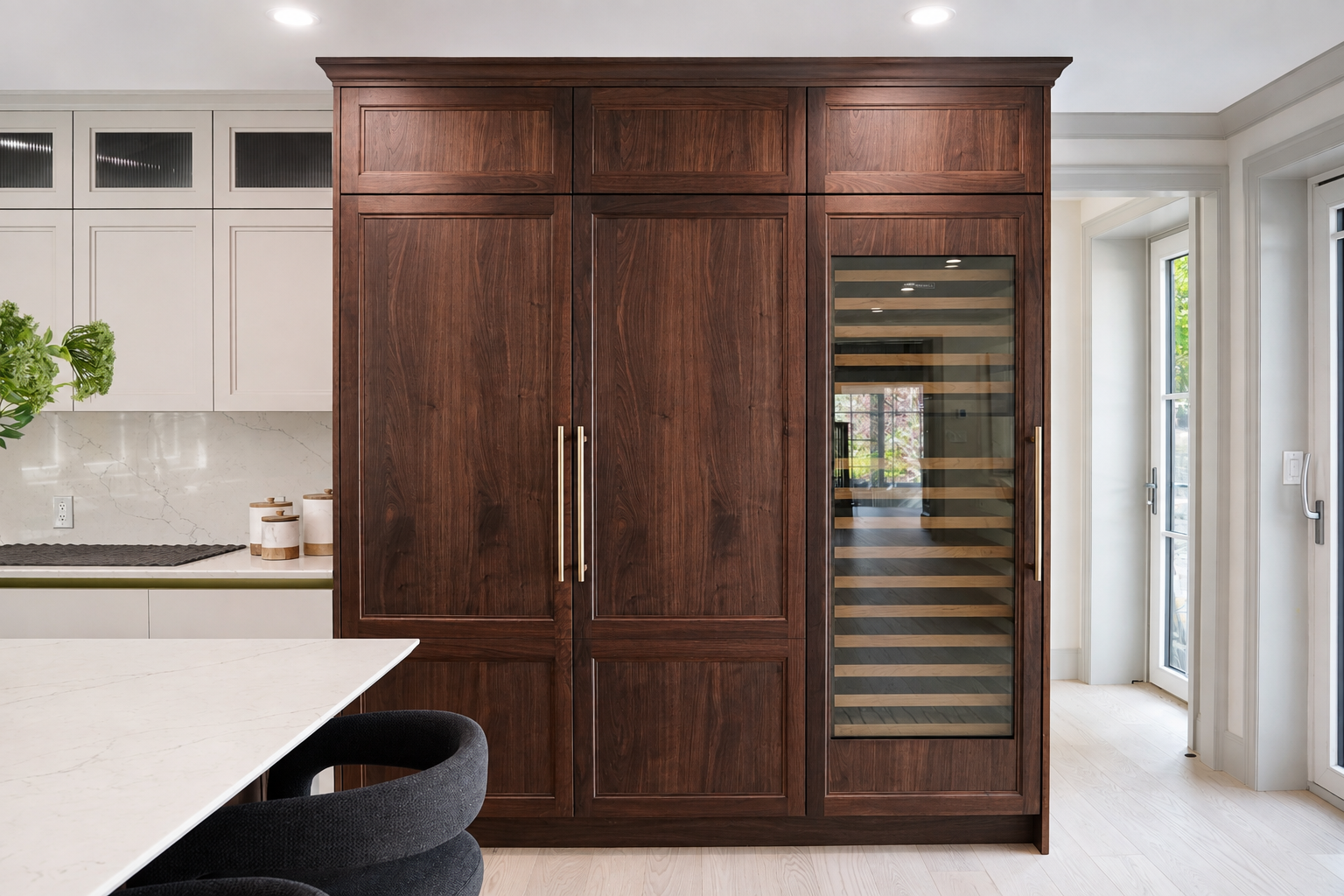 Dark wood storage wall with a glass-front wine cabinet in the Clinton Road kitchen