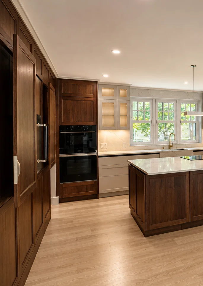 Walnut veneer kitchen cabinetry and island in the Brookline renovation