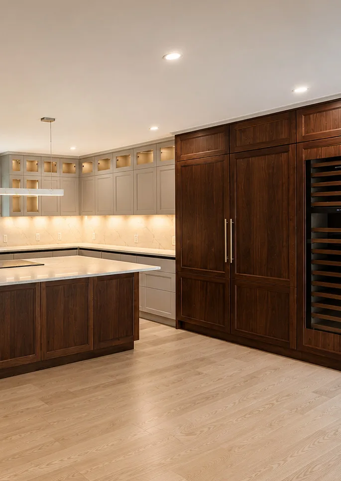 Walnut cabinetry surrounding a kitchen island in the Brookline renovation