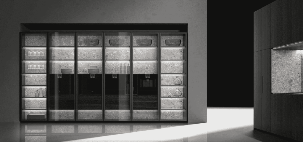A modern European kitchen featuring sleek glass-front cabinets with integrated lighting, showcasing elegant shelving and minimalist design.